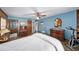 Bedroom featuring blue walls, hardwood floors, and furniture at 2500 Lake Shore Dr, Orlando, FL 32803