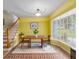 Bright dining room featuring a classic table, brick floor, and bay window providing ample natural light at 2500 Lake Shore Dr, Orlando, FL 32803