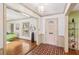 Inviting foyer with brick floors, view into the living room, and neutral wall colors at 2500 Lake Shore Dr, Orlando, FL 32803