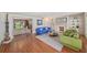 Spacious living room with hardwood floors, fireplace, and comfortable seating arrangement at 2500 Lake Shore Dr, Orlando, FL 32803