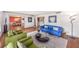 Bright and airy living room with hardwood floors, colorful furniture, and ample natural light at 2500 Lake Shore Dr, Orlando, FL 32803