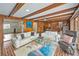 Relaxing living room with beamed ceilings, tile floor, and comfortable seating area at 2500 Lake Shore Dr, Orlando, FL 32803