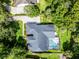 Bird's-eye view showcasing screened pool and lush surroundings at 2608 Westminster Ter, Oviedo, FL 32765