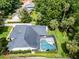 Overhead property shot with pool and surrounding neighborhood at 2608 Westminster Ter, Oviedo, FL 32765
