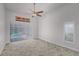Bedroom with large windows overlooking the pool area, providing natural light at 2608 Westminster Ter, Oviedo, FL 32765
