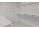 Walk-in closet with white shelving and ample storage space at 2608 Westminster Ter, Oviedo, FL 32765