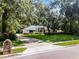 Suburban home exterior featuring a large front yard and driveway at 2608 Westminster Ter, Oviedo, FL 32765