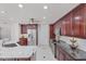 Modern kitchen with stainless steel appliances, granite countertops, and ample cabinet space at 2608 Westminster Ter, Oviedo, FL 32765
