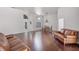 Spacious living room with hardwood floors and stylish furniture, perfect for entertaining at 2608 Westminster Ter, Oviedo, FL 32765