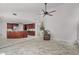 Living room featuring tile floors and an open design to the kitchen area at 2608 Westminster Ter, Oviedo, FL 32765