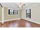 Bedroom with beautiful hardwood floors, decorative trim, and bright natural light at 26586 Se Highway 42, Umatilla, FL 32784