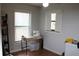 Well-lit bedroom with a functional desk setup and large windows at 26586 Se Highway 42, Umatilla, FL 32784