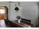 Bright dining room featuring a rustic wood table, bench seating, and contemporary decor at 26586 Se Highway 42, Umatilla, FL 32784