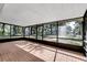 Enclosed patio with brick flooring and views of the surrounding landscape at 26586 Se Highway 42, Umatilla, FL 32784