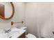 Half bathroom with a decorative mirror at 27714 Lois Dr, Tavares, FL 32778