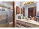 A full bathroom featuring a shower, vanity, sink, and plenty of storage at 27714 Lois Dr, Tavares, FL 32778