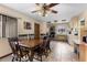 An inviting dining room is adjacent to the kitchen and offers a ceiling fan and tiled floors at 27714 Lois Dr, Tavares, FL 32778
