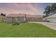 Charming single-story home with a well-maintained lawn and colorful flower garden at 27714 Lois Dr, Tavares, FL 32778