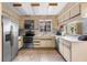 Bright kitchen with stainless steel appliances and a window view at 27714 Lois Dr, Tavares, FL 32778