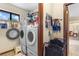 Laundry room with new washer and dryer at 27714 Lois Dr, Tavares, FL 32778