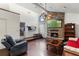 Cozy living room with stone fireplace and hardwood floors at 27714 Lois Dr, Tavares, FL 32778