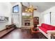 Inviting living room with a stone fireplace and vaulted ceiling at 27714 Lois Dr, Tavares, FL 32778