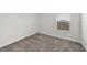Neutral bedroom featuring a carpeted floor, a window, and electrical outlets on the lower wall at 3124 Addison Blvd, St Cloud, FL 34771