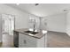 Modern kitchen island with a stainless steel sink at 3124 Addison Blvd, St Cloud, FL 34771