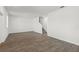 Bright living room with wood-look floors and staircase at 3124 Addison Blvd, St Cloud, FL 34771