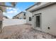 Private outdoor brick patio with a white fence, exterior lighting, and access to the home at 3124 Addison Blvd, St Cloud, FL 34771