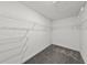 Functional walk-in closet with ample storage space provided by white wire shelving on multiple levels at 3124 Addison Blvd, St Cloud, FL 34771
