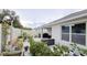 Backyard featuring a patio, white fencing, and an array of potted plants at 3202 Timber Hawk Cir, Ocoee, FL 34761