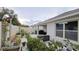 Backyard with large paved patio, plants, grill and surrounding fence at 3202 Timber Hawk Cir, Ocoee, FL 34761