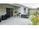 View of backyard with patio, sliding door access, and potted plants at 3202 Timber Hawk Cir, Ocoee, FL 34761