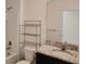 Bathroom featuring granite countertops, dark wood cabinetry, and modern fixtures at 3202 Timber Hawk Cir, Ocoee, FL 34761