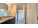 Bathroom featuring double vanity with granite countertop and a walk-in shower at 3202 Timber Hawk Cir, Ocoee, FL 34761
