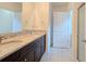 Bathroom featuring a dual vanity with granite countertops and tile flooring at 3202 Timber Hawk Cir, Ocoee, FL 34761
