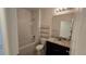 Bright bathroom features a shower-tub combo and granite vanity top at 3202 Timber Hawk Cir, Ocoee, FL 34761