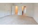 Large, carpeted main bedroom with ensuite bathroom and walk in closet at 3202 Timber Hawk Cir, Ocoee, FL 34761