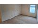 Bedroom with closet, carpet and window at 3202 Timber Hawk Cir, Ocoee, FL 34761