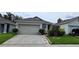 Charming single-Gathering home with a two-car garage and well-maintained lawn and garden at 3202 Timber Hawk Cir, Ocoee, FL 34761