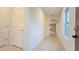 Bright hallway with tile flooring, arched doorway, and neutral color palette at 3202 Timber Hawk Cir, Ocoee, FL 34761