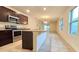 Kitchen with stainless appliances, granite countertops, and open to the living area at 3202 Timber Hawk Cir, Ocoee, FL 34761