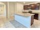 Modern kitchen with granite countertops, stainless steel appliances, and center island at 3202 Timber Hawk Cir, Ocoee, FL 34761