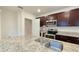 Close-up of kitchen island featuring granite countertops, stainless sink, and faucet at 3202 Timber Hawk Cir, Ocoee, FL 34761