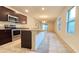 A kitchen featuring stainless appliances, granite counter tops and an island with a sink at 3202 Timber Hawk Cir, Ocoee, FL 34761
