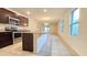 Open kitchen featuring granite countertops, stainless steel appliances, and tile flooring at 3202 Timber Hawk Cir, Ocoee, FL 34761