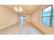 Bright, tiled living room with lots of natural light flowing in from windows and a glass slider at 3202 Timber Hawk Cir, Ocoee, FL 34761