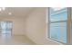 Bright and open living room with windows and neutral walls at 3202 Timber Hawk Cir, Ocoee, FL 34761