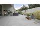 Landscaped patio with planters and gardening bench against white fence at 3202 Timber Hawk Cir, Ocoee, FL 34761